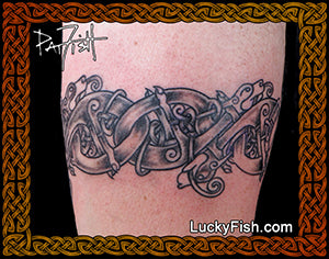 Tattoo of interlocking Celtic knots Hunting Dog ArmBand Celtic Tattoo Design on a person's arm with 'Lucky Fish' branding.