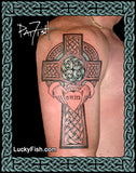 Celtic cross tattoo on a person's arm with 'Lucky Fish' branding.