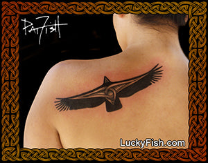 Tattoo of a Celtic condor bird design on a person's shoulder with 'Lucky Fish' branding.