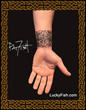 Hand with a Celtic knot wrist tattoo by Pat Fish with LuckyFish branding.