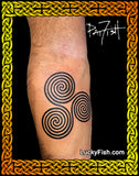 photo of triple spiral tattoo on forearm