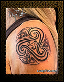 black graphic wave tattoo on shoulder