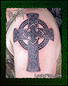 Celtic cross tattoo on a person's arm with Lucky Fish logo.
