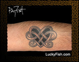 Tattoo of a Celtic knot design on skin with 'Lucky Fish' branding.