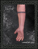triple spiral Celtic tattoo band around the arm