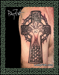 photo of tattoo of cross with tree of life