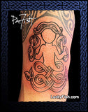 Tattoo of a Pictish mermaid design on a person's arm with 'Lucky Fish' branding.