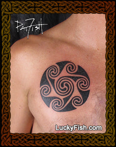 Tattoo of a black Celtic triple spiral design on a person's chest by Pat Fish with LuckyFish.com branding.