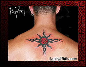 Tribal tattoo sun on a person's back with a red and black central design, branded 'Lucky Fish' at the bottom.