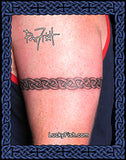 Celtic warrior arm band tattoo on a person's arm with 'Lucky Fish' branding.