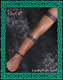 three Celtic knot tattoo bands on arm
