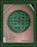 Green circular Celtic knot tattoo on skin by Pat Fish and 'Lucky Fish.com' branding.