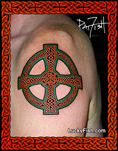 Celtic cross tattoo on a shoulder with 'Lucky Fish' branding.