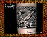 Tattoo of Celtic design by Pat Fish on a person's arm with 'Lucky Fish' branding.