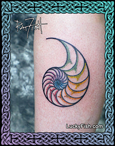 Colorful nautilus shell tattoo on a person's arm with 'Lucky Fish' branding.