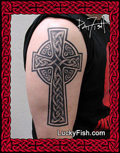 Celtic cross tattoo on a person's arm with LuckyFish.com branding.
