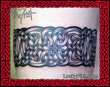 Celtic knot tattoo band design on arm with 'Lucky Fish' branding.