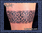 Celtic knot tattoo on a person's arm with 'Lucky Fish' branding.