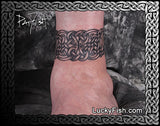 Celtic knot band tattoo on an ankle with 'LuckyFish.com' branding.