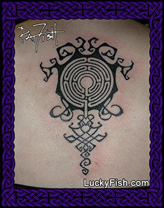 A tattoo of a fractal labyrinth design on a person's back, showcasing a tribal and geometric pattern.