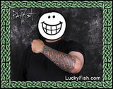 Person with Celtic knotwork sleeve tattoos on arm and LuckyFish.com branding.