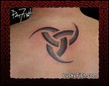 Horns of Odin Viking tattoo on a person's back with Lucky Fish branding.