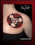 Tribal tattoo design of triple Celtic ravens on a shoulder with 'Lucky Fish' branding.