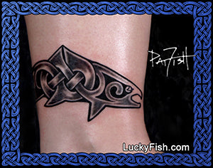 Tattoo of a salmon fish design with Celtic knots on a person's ankle with 'Lucky Fish' branding.