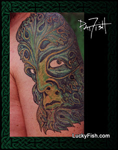 Tattoo of a Greenman with foliage patterns on a person's arm, artist Pat Fosh and website LuckyFish.com