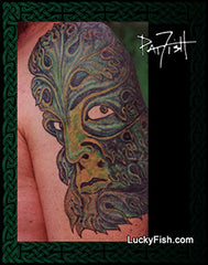 Tattoo of a Greenman with foliage patterns on a person's arm, artist Pat Fosh and website LuckyFish.com