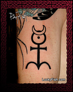 Tattoo of a mercury symbol on a person's arm with 'LuckyFish.com' branding.