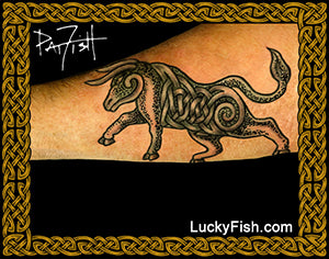 A tattoo of a Celtic-style bull with spiral details, shown applied to forearm skin. The image features a black and gold Celtic knot border, a white 'PatFish' signature in the top left, and 'LuckyFish.com