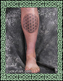 Tattoo of a flower of life design on a person's leg with Lucky Fish branding.