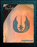 Tattoo of Star Wars Jedi Knights symbol on a person's shoulder with 'Lucky Fish' branding.