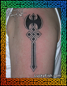 Tattoo of a black labrys symbol on a person's arm symbol of lesbian strength