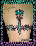 Tattoo of a blabrys and armband with Celtic knot design on a person's arm, signed by Lucky Fish.