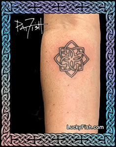 Celtic flower tattoo design on forearm