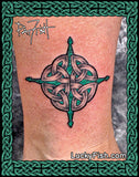 Celtic knot tattoo on skin with artist Pat Fish signature and 'Lucky Fish' branding.
