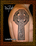 A large black Celtic cross tattoo with intricate knotwork designs applied to a person's upper armand shoulder, shown against a dark background with decorative borders and the text 'Pat Fish' and 'LuckyFish.com'.