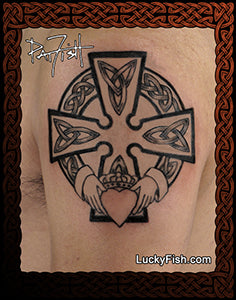 Tattoo design tattoo of a Celtic cross with claddagh hands holding a heart on arm with intricate Celtic knotwork.