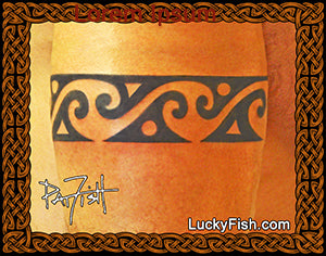 Tribal wave arm band tattoo design on skin with 'Lucky Fish' branding