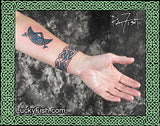 Pictish tattoo crescent on forearm photo