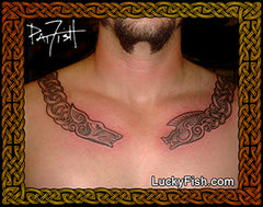 Tattoo on a person's chest of  Celtic torc with wolf and boar head finials with 'Lucky Fish' branding.