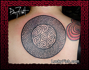 Tattoo of a Celtic Pictish key pattern knot design on a woman's back with Lucky Fish branding.