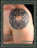Nordic Viking knot tattoo on a person's arm with 'Lucky Fish' branding.