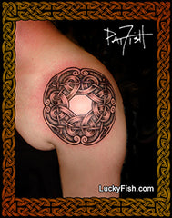 Viking Nordic warrior knot tattoo on a person's arm with 'Lucky Fish' branding.