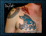 Tattoo of a blue and black Pictish boar design on a person's chest with 'Lucky Fish' branding.