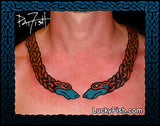 Celtic torc necklace tattoo with dog head designs on a person's neck, branded 'Lucky Fish'.