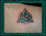 Celtic knot tattoo on skin with Lucky Fish logo at the bottom.