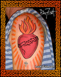 A photo of a person's upper arm with a colorful Sacred Heart tattoo design, featuring a red heart with orange flames and a black thorns, by tattoo artist Pat Fish